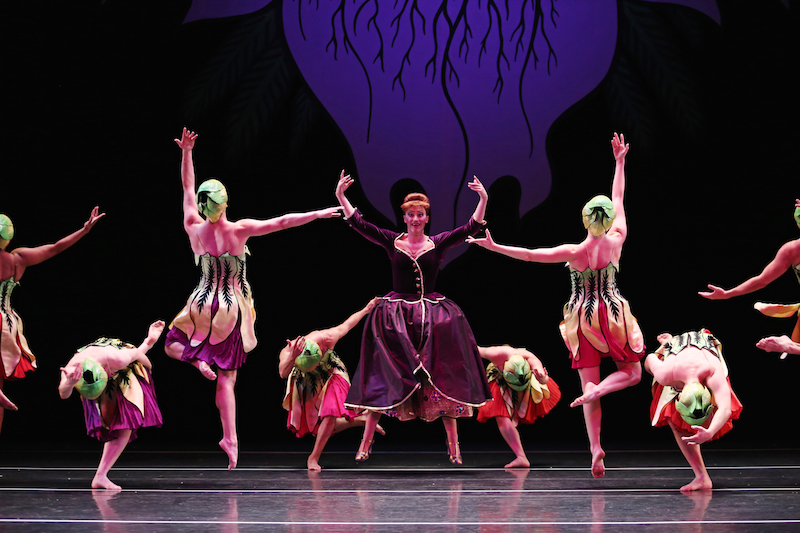 John Heginbotham leads the Waltz of the Flowers. The flower dancers wear head garments and dresses that resemble droopy flower petals